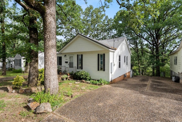 2515 N Dr, North Little Rock, AR 72118 - view of front of house with a metal roof and driveway