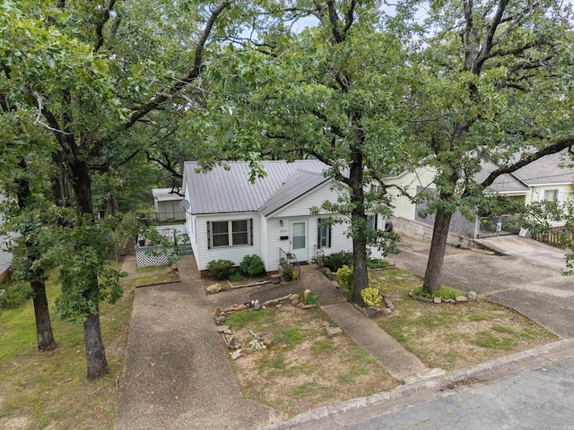 2515 N Dr, North Little Rock, AR 72118 - view of front of house with driveway and a metal roof