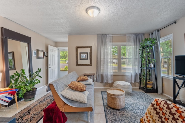 2515 N Dr, North Little Rock, AR 72118 - living room with a textured ceiling and tile patterned flooring
