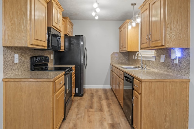 70 Peach St, Austin, AR 72007 - kitchen featuring black appliances, tasteful backsplash, light wood finished floors, light brown cabinetry, and decorative light fixtures