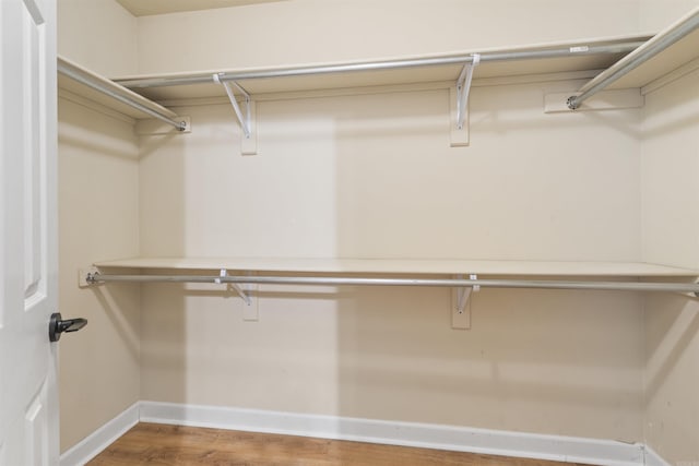 70 Peach St, Austin, AR 72007 - walk in closet featuring wood finished floors