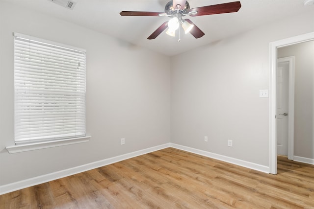 70 Peach St, Austin, AR 72007 - empty room with a ceiling fan, light wood-style floors, and plenty of natural light