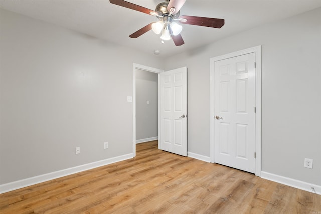 70 Peach St, Austin, AR 72007 - unfurnished bedroom with light wood-style floors and ceiling fan