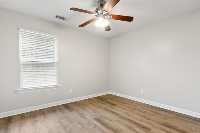 70 Peach St, Austin, AR 72007 - empty room with a ceiling fan and wood finished floors
