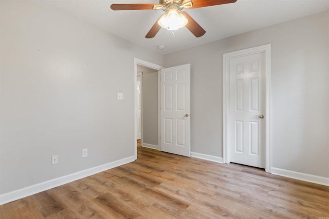 70 Peach St, Austin, AR 72007 - unfurnished bedroom with light wood-style flooring and ceiling fan