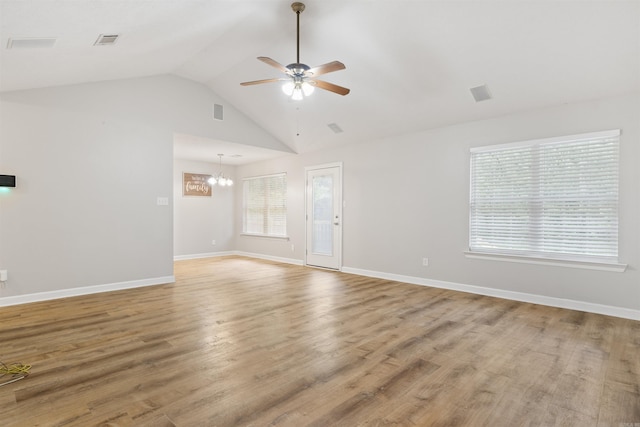 70 Peach St, Austin, AR 72007 - unfurnished living room with a ceiling fan, a chandelier, wood finished floors, and high vaulted ceiling