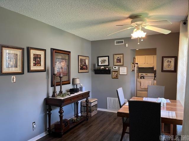 600 Higdon Ferry Rd Unit 301, Hot Springs, AR 71913 - dining room featuring a ceiling fan, dark wood finished floors, and a textured ceiling