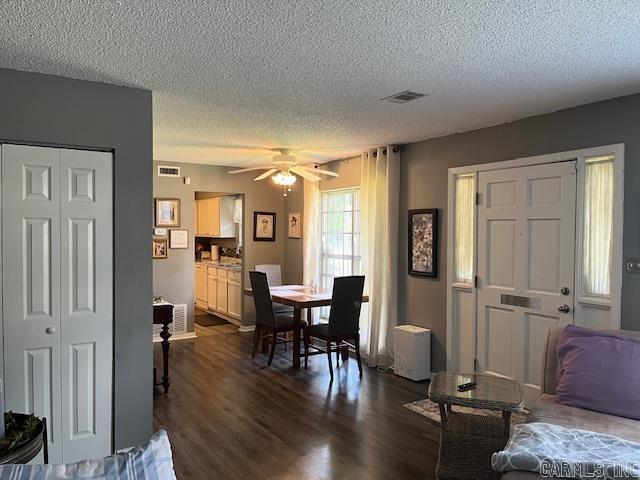600 Higdon Ferry Rd Unit 301, Hot Springs, AR 71913 - dining area with a textured ceiling, dark wood-style flooring, and ceiling fan