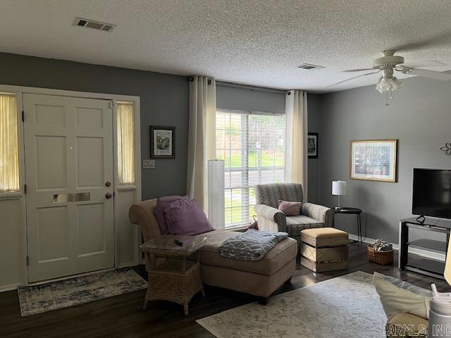 600 Higdon Ferry Rd Unit 301, Hot Springs, AR 71913 - living area with dark wood-style flooring, ceiling fan, and a textured ceiling