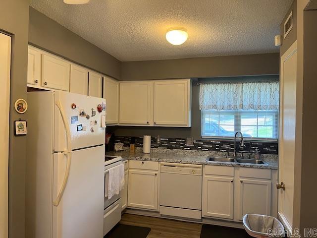 600 Higdon Ferry Rd Unit 301, Hot Springs, AR 71913 - kitchen featuring white appliances, white cabinetry, a textured ceiling, and dark wood-type flooring