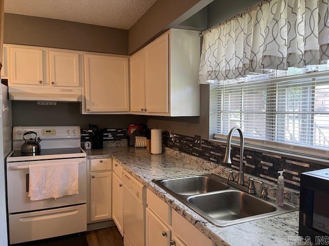 600 Higdon Ferry Rd Unit 301, Hot Springs, AR 71913 - kitchen with under cabinet range hood, white appliances, white cabinetry, a textured ceiling, and light countertops