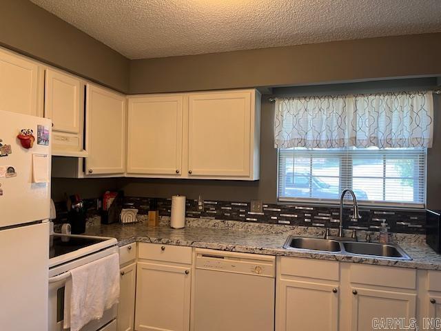 600 Higdon Ferry Rd Unit 301, Hot Springs, AR 71913 - kitchen featuring white appliances, white cabinets, a textured ceiling, and ventilation hood