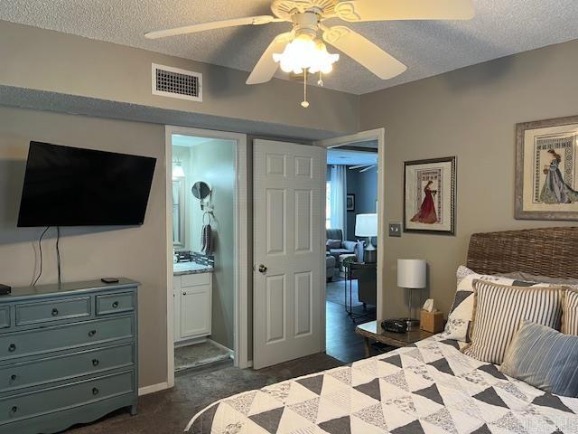 600 Higdon Ferry Rd Unit 301, Hot Springs, AR 71913 - bedroom featuring a textured ceiling, ensuite bath, ceiling fan, and dark carpet