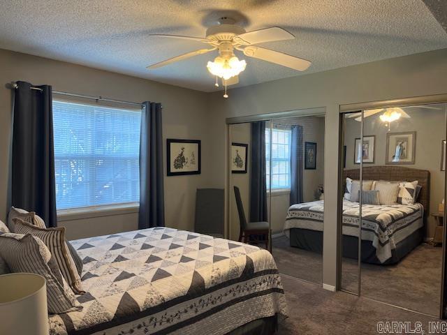 600 Higdon Ferry Rd Unit 301, Hot Springs, AR 71913 - carpeted bedroom with multiple closets, a textured ceiling, and ceiling fan