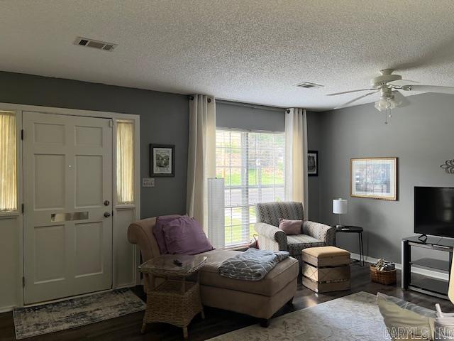 600 Higdon Ferry Rd Unit 301, Hot Springs, AR 71913 - living area featuring dark wood finished floors, a ceiling fan, and a textured ceiling