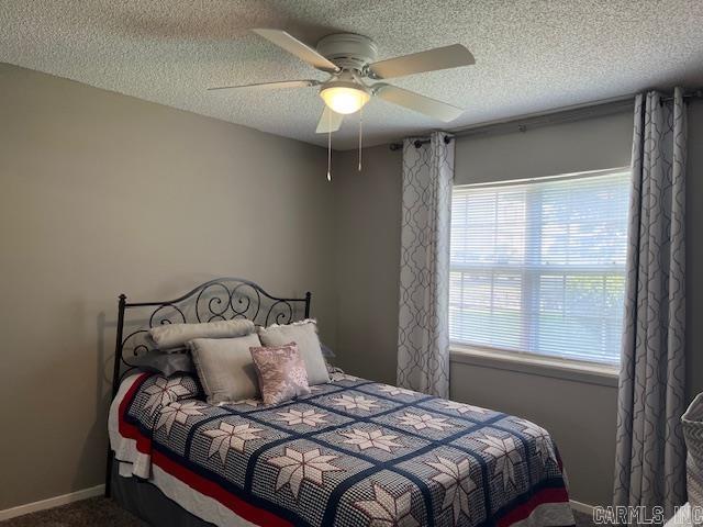 600 Higdon Ferry Rd Unit 301, Hot Springs, AR 71913 - carpeted bedroom with multiple windows, a textured ceiling, and ceiling fan