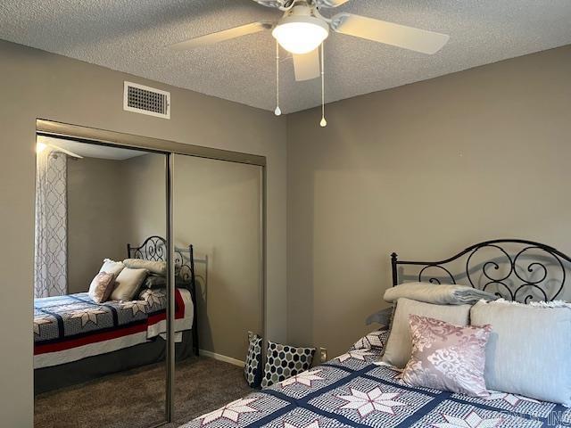 600 Higdon Ferry Rd Unit 301, Hot Springs, AR 71913 - carpeted bedroom with a closet, a textured ceiling, and ceiling fan