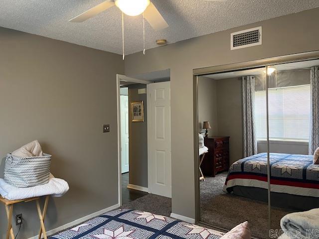 600 Higdon Ferry Rd Unit 301, Hot Springs, AR 71913 - carpeted bedroom with a closet, a textured ceiling, and a ceiling fan