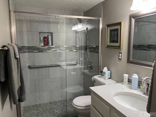 600 Higdon Ferry Rd Unit 301, Hot Springs, AR 71913 - bathroom with vanity, a textured ceiling, and a stall shower