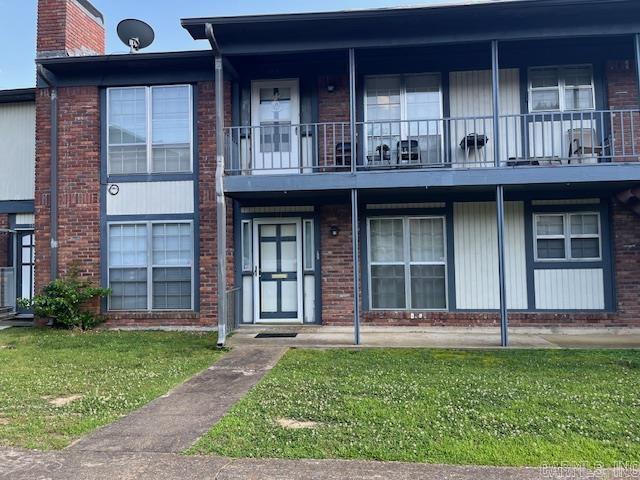 600 Higdon Ferry Rd Unit 301, Hot Springs, AR 71913 - multi unit property featuring brick siding, a front yard, a chimney, and a balcony