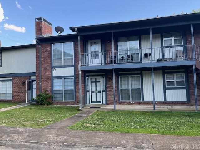 600 Higdon Ferry Rd Unit 301, Hot Springs, AR 71913 - view of front of house with a chimney, brick siding, and a balcony