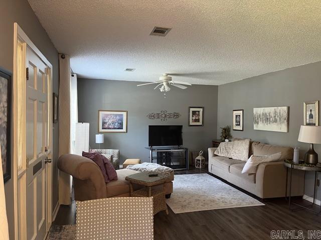 600 Higdon Ferry Rd Unit 301, Hot Springs, AR 71913 - living room featuring dark wood-type flooring, a ceiling fan, and a textured ceiling