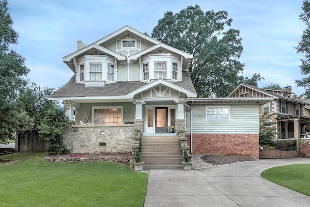 102 Midland, Little Rock, AR 72205 - view of front of house with stone siding, a chimney, and covered porch