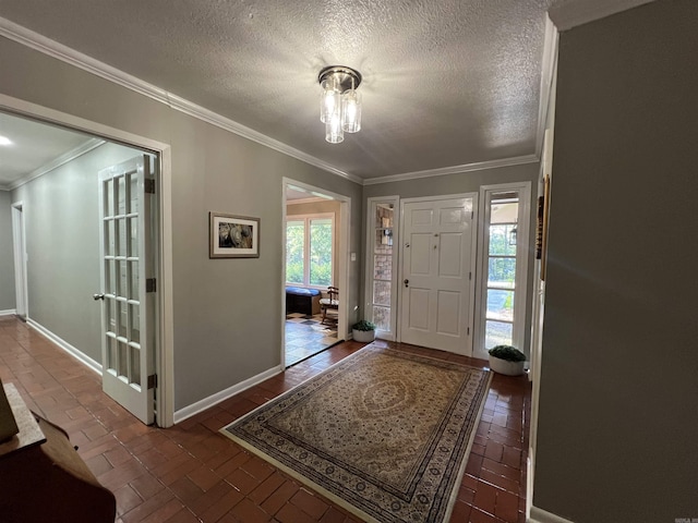 114 Mark Cir, Monticello, AR 71655 - foyer entrance featuring brick flooring, a textured ceiling, and crown molding