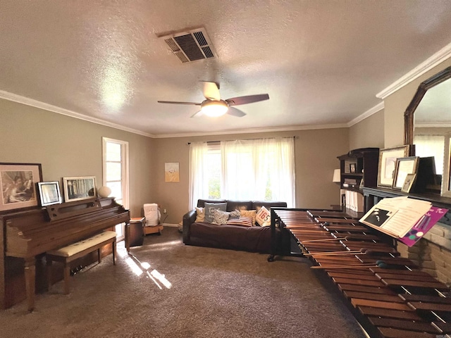114 Mark Cir, Monticello, AR 71655 - carpeted living room featuring plenty of natural light, a ceiling fan, ornamental molding, and a textured ceiling