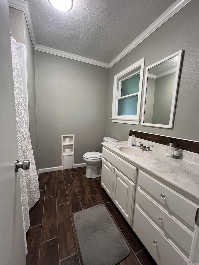 114 Mark Cir, Monticello, AR 71655 - bathroom with vanity, a textured ceiling, wood tiled floors, and ornamental molding
