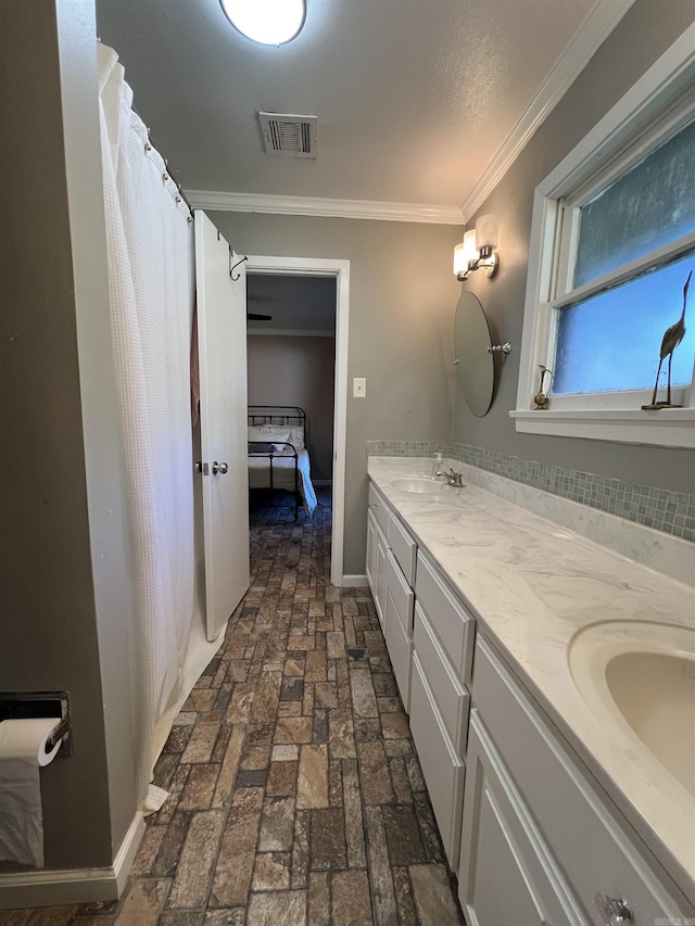 114 Mark Cir, Monticello, AR 71655 - full bathroom featuring double vanity, brick flooring, crown molding, and ensuite bath