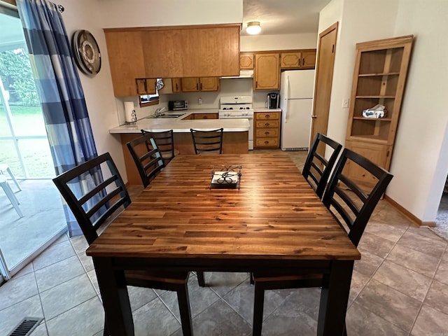504 Case St, Heber Springs, AR 72543 - dining area featuring light tile patterned floors