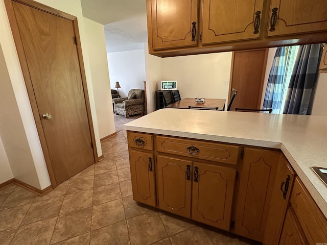 504 Case St, Heber Springs, AR 72543 - kitchen with light countertops and brown cabinets
