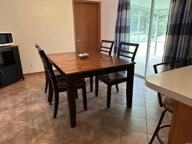 504 Case St, Heber Springs, AR 72543 - dining room featuring tile patterned flooring and baseboards