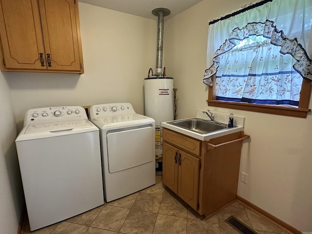 504 Case St, Heber Springs, AR 72543 - washroom featuring separate washer and dryer, gas water heater, cabinet space, and light tile patterned floors