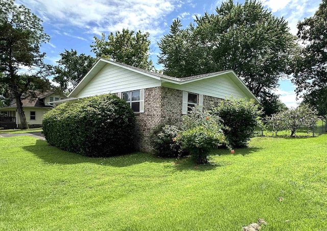 504 Case St, Heber Springs, AR 72543 - view of side of property with a yard and brick siding