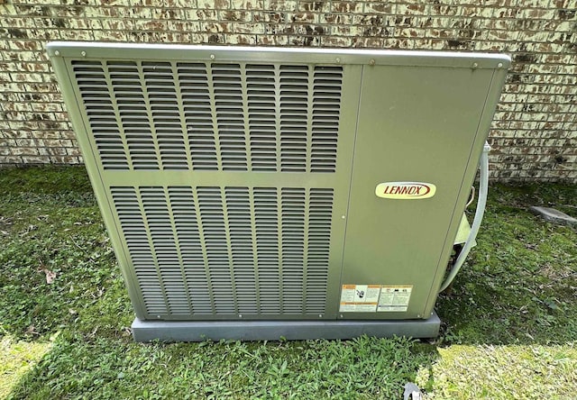 504 Case St, Heber Springs, AR 72543 - exterior view of a cooling unit and brick siding