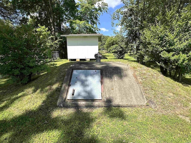 504 Case St, Heber Springs, AR 72543 - entry to storm shelter featuring a yard and a storage unit