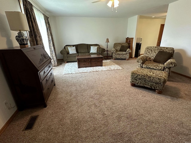 504 Case St, Heber Springs, AR 72543 - carpeted living area with ceiling fan and baseboards