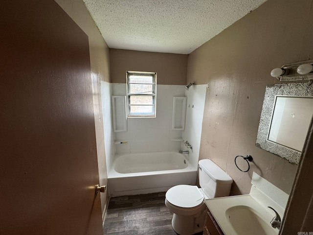 4114 W 10th Ave, Pine Bluff, AR 71603 - full bath featuring wood finished floors, vanity, a textured ceiling, bathtub / shower combination, and a textured wall