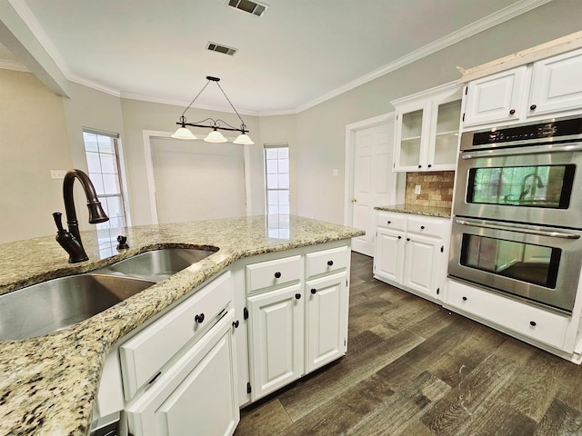 158 Calais, Maumelle, AR 72113 - kitchen with double oven, dark wood finished floors, crown molding, light stone counters, and glass insert cabinets