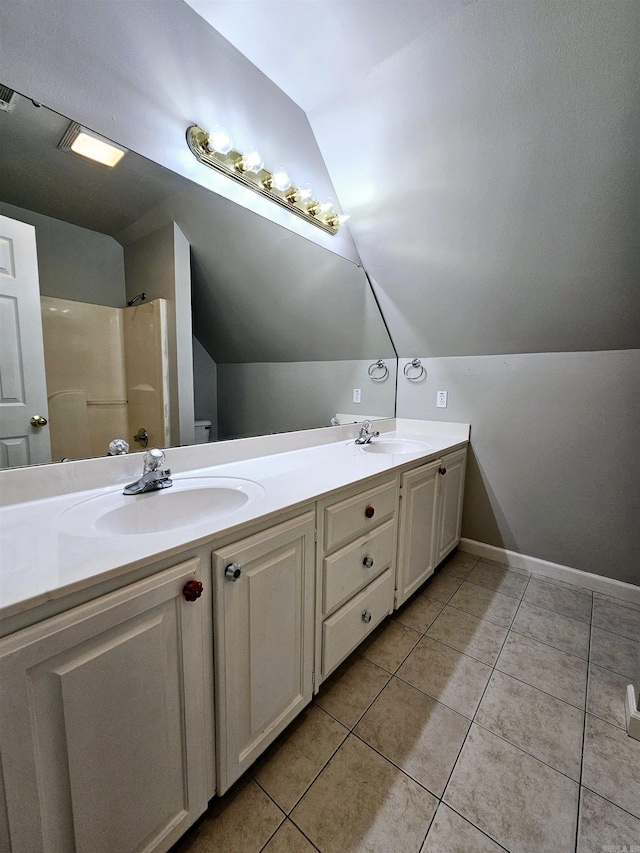 158 Calais, Maumelle, AR 72113 - full bathroom with vaulted ceiling, tile patterned flooring, double vanity, and a shower