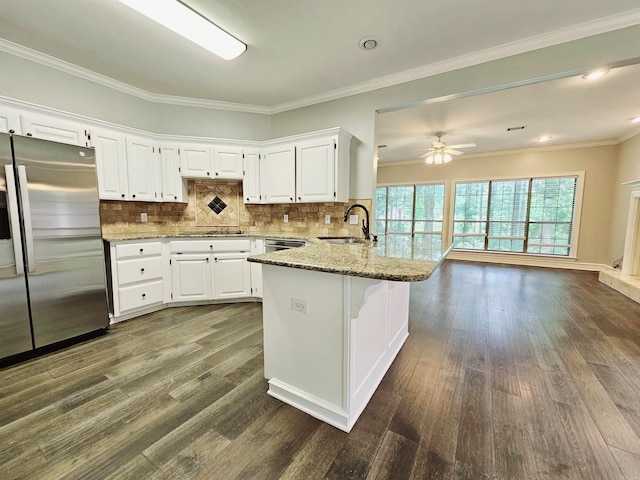 158 Calais, Maumelle, AR 72113 - kitchen featuring stainless steel appliances, dark wood-style flooring, light stone counters, a peninsula, and crown molding