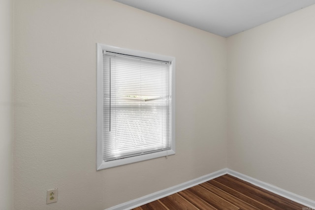 503 N Walnut St, Searcy, AR 72143 - unfurnished room featuring dark wood-style flooring and baseboards