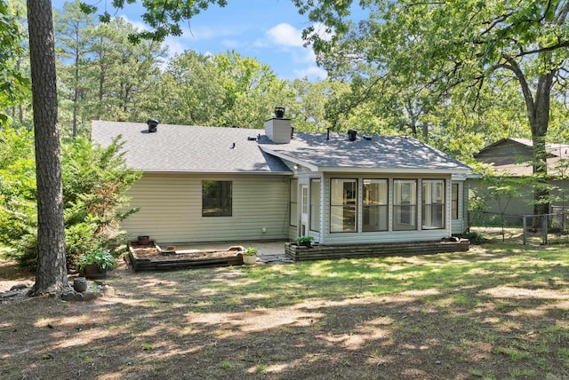 12611 Timber Bend Dr, Little Rock, AR 72211 - rear view of property with a chimney, a sunroom, and a shingled roof