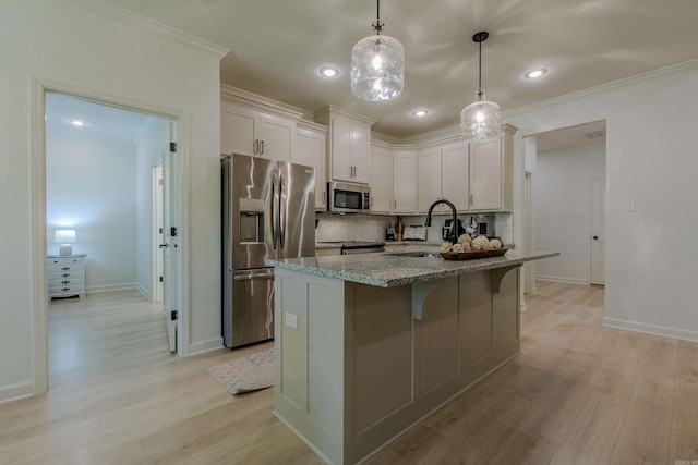 18508 Parkway Pines Dr, Bauxite, AR 72011 - kitchen featuring stainless steel appliances, tasteful backsplash, light wood finished floors, light stone countertops, and ornamental molding