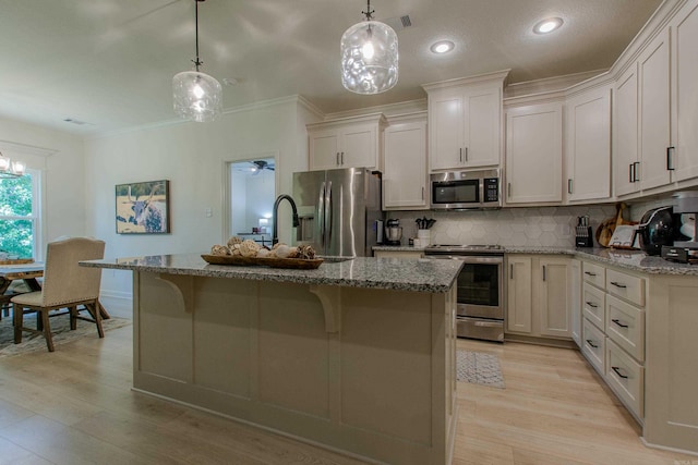 18508 Parkway Pines Dr, Bauxite, AR 72011 - kitchen featuring stainless steel appliances, light wood-style floors, backsplash, light stone counters, and crown molding