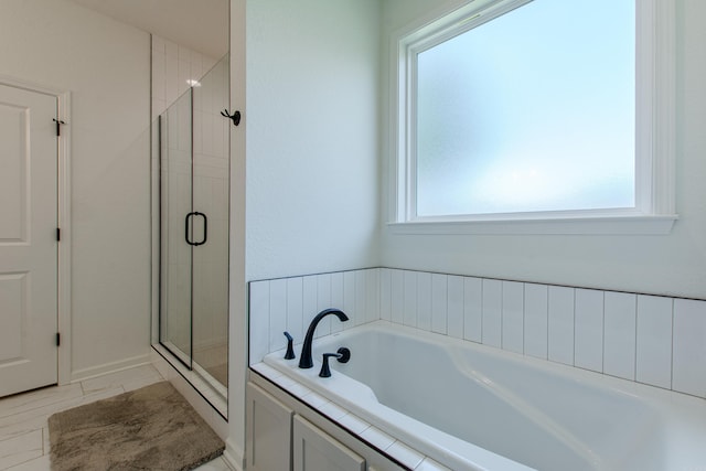18508 Parkway Pines Dr, Bauxite, AR 72011 - bathroom with a garden tub, a shower stall, and plenty of natural light