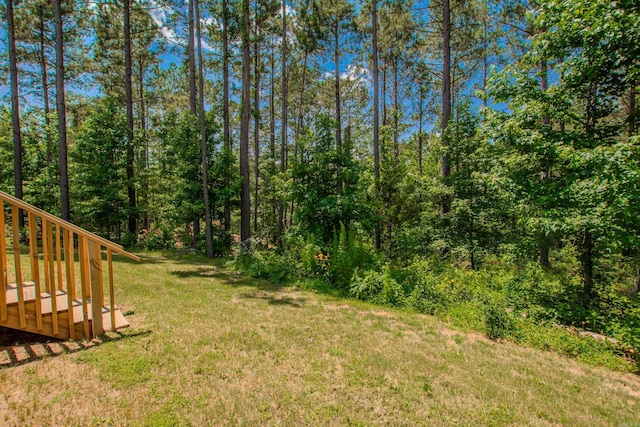 18508 Parkway Pines Dr, Bauxite, AR 72011 - view of green lawn featuring a forest view