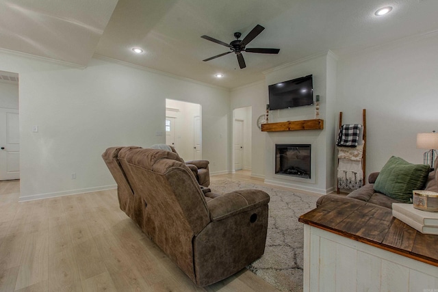 18508 Parkway Pines Dr, Bauxite, AR 72011 - living area featuring crown molding, ceiling fan, light wood-type flooring, a glass covered fireplace, and recessed lighting